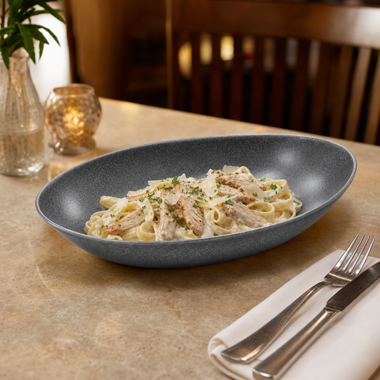 AILUKE AL-SG-OP26 oval stainless steel plate in an American restaurant setting